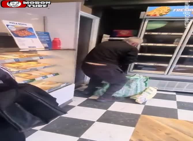 Video :Everyone watches in awe as a robber robs a Greggs bakery totally